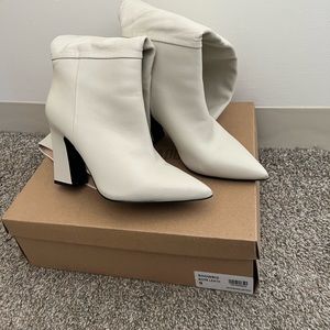 SM “Showbiz” white leather boots